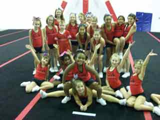 Cheerleaders on cheer mats